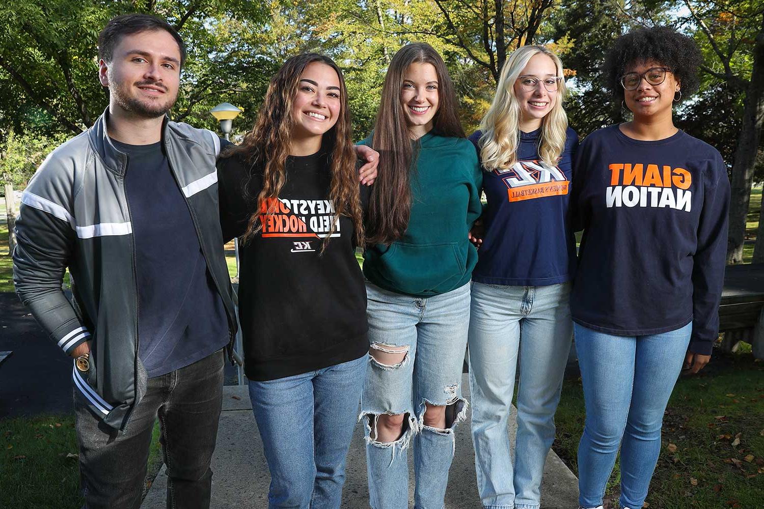 Five Students In Front Of Harris Hall